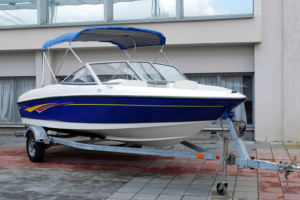 Boat on trailer with blue, orange and Yellow Design