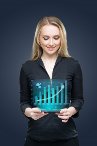 female holding digital graph showing increase in online traffic